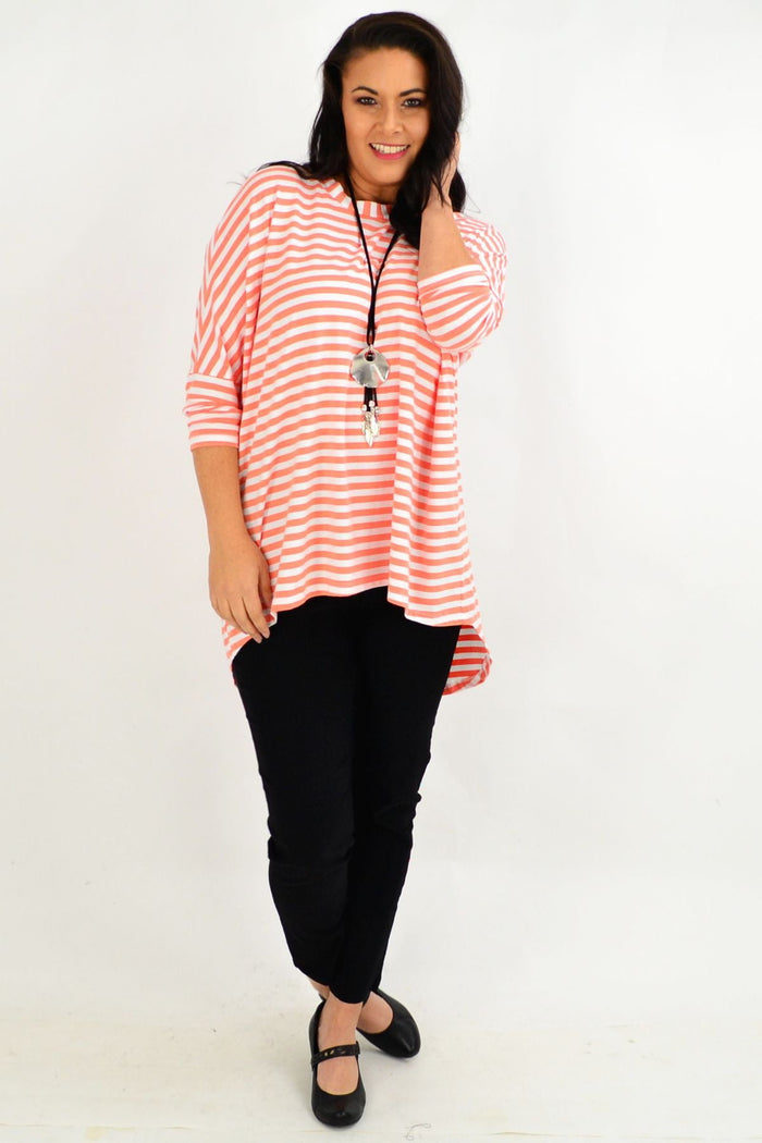 Pink and white striped Coral Swing Tunic Top by Cordelia St with long sleeves and a relaxed, flowing silhouette.