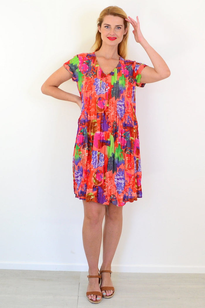 Orange tropical Nicola dress tunic by One Summer featuring cap sleeves, lightweight fabric, and vibrant tropical print.