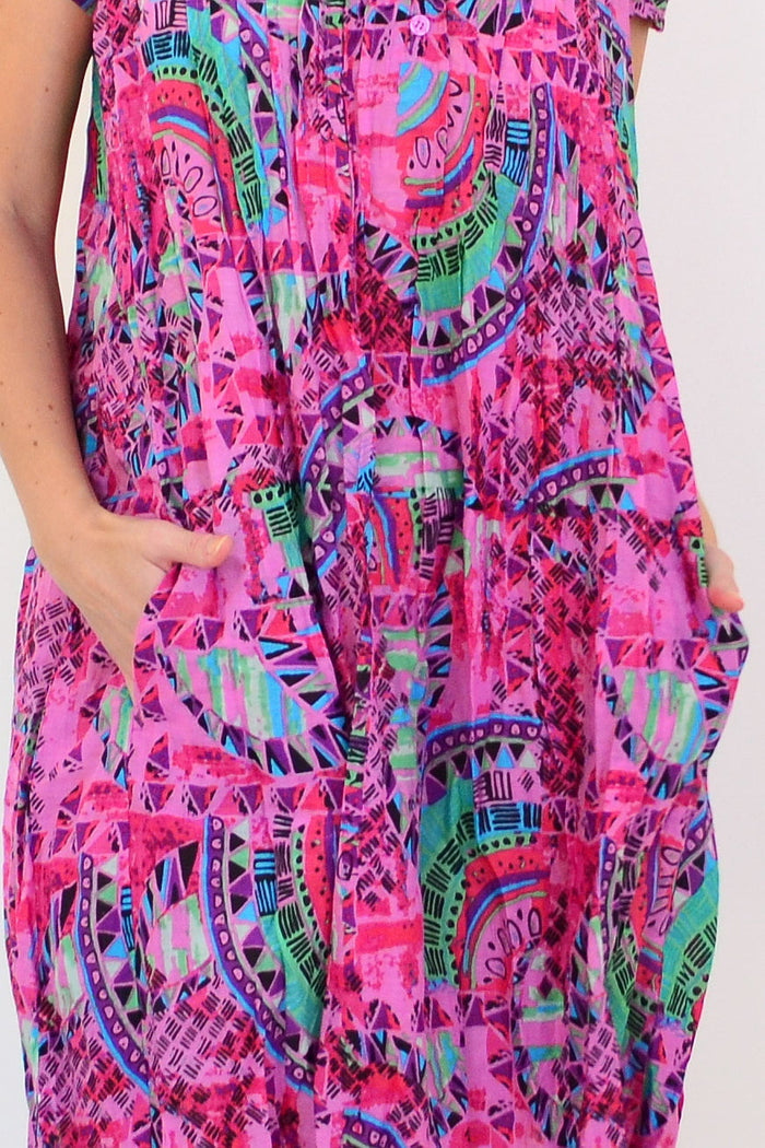 Pink Tropical Nicola Dress Cap Sleeve Tunic by One Summer, featuring a vibrant tropical print and a relaxed, sleeveless design.