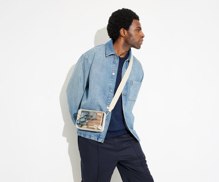 The clear Stadium Bag worn crossbody on male talent, letting her be hands free, and showing how clear the bag so it meets stadium and venue regulations
//
Model is 6'2"