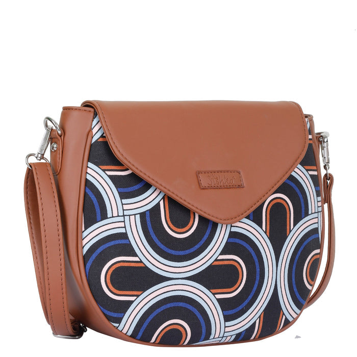 Abstract printed canvas shoulder‑sling bag with tall soft silhouette for office and daily use-half side view