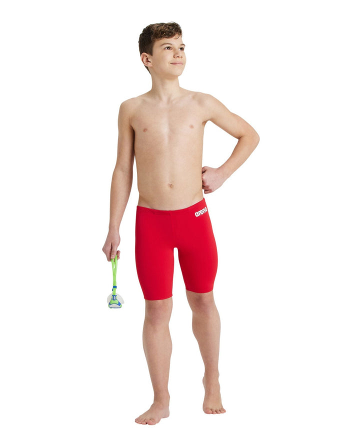 Red Arena boys team solid swim jammer with white logo and green razor handle