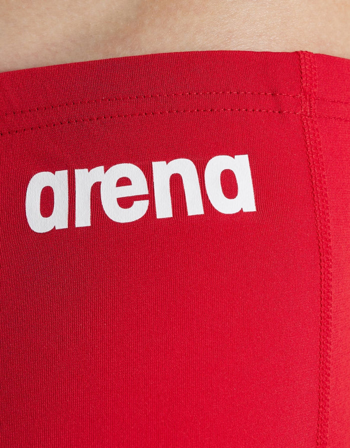 Red Arena boys team solid swim jammer with white logo straps