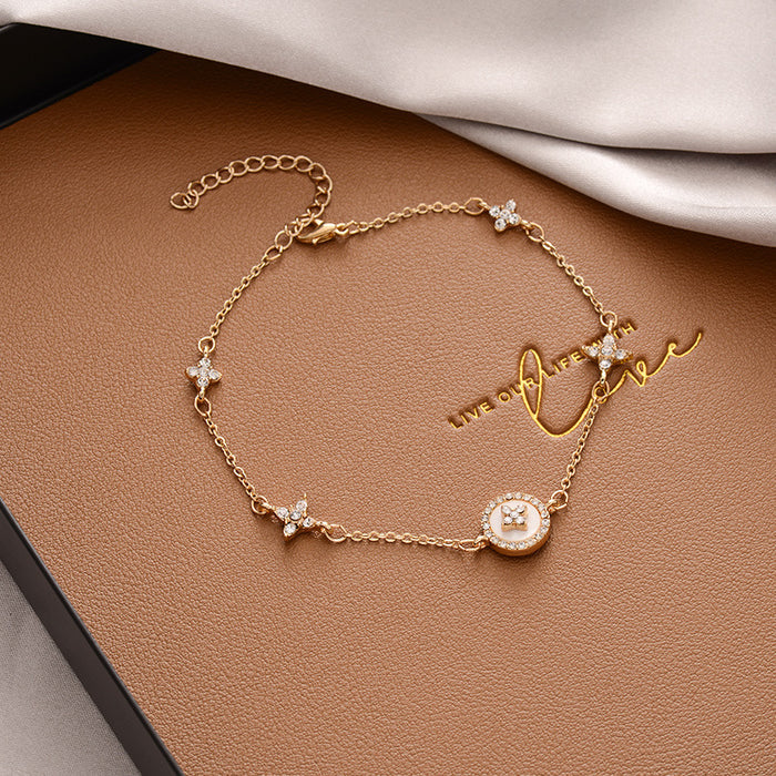 B898 - Plum Blossom Cross Bracelet