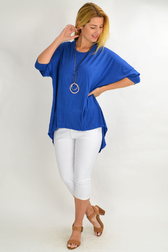 Blue bamboo tunic top by Hourglass, featuring a relaxed fit with long sleeves and a round neckline, displayed on a hanger.