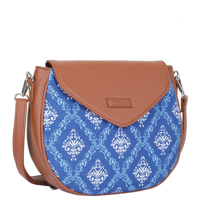Blue printed canvas shoulder‑sling bag with tall soft silhouette for work and everyday use-half side view