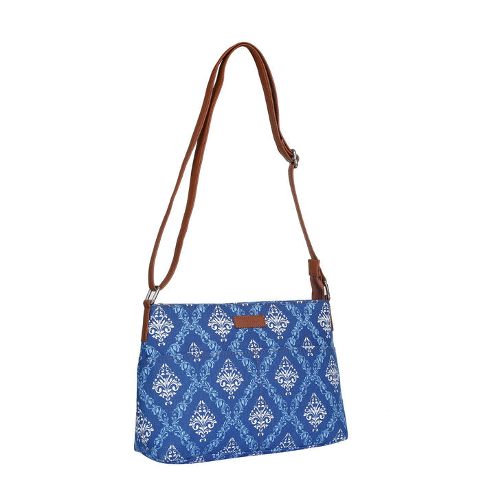 Blue printed canvas shoulder‑sling bag with soft relaxed silhouette for work and everyday use-half side view