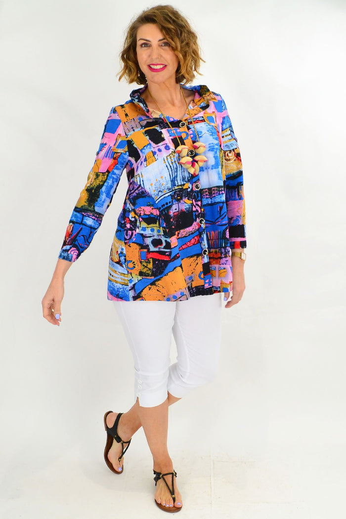 Blue high collar tunic shirt by Ruby Rain featuring a sleek design and comfortable fit, displayed on a hanger.