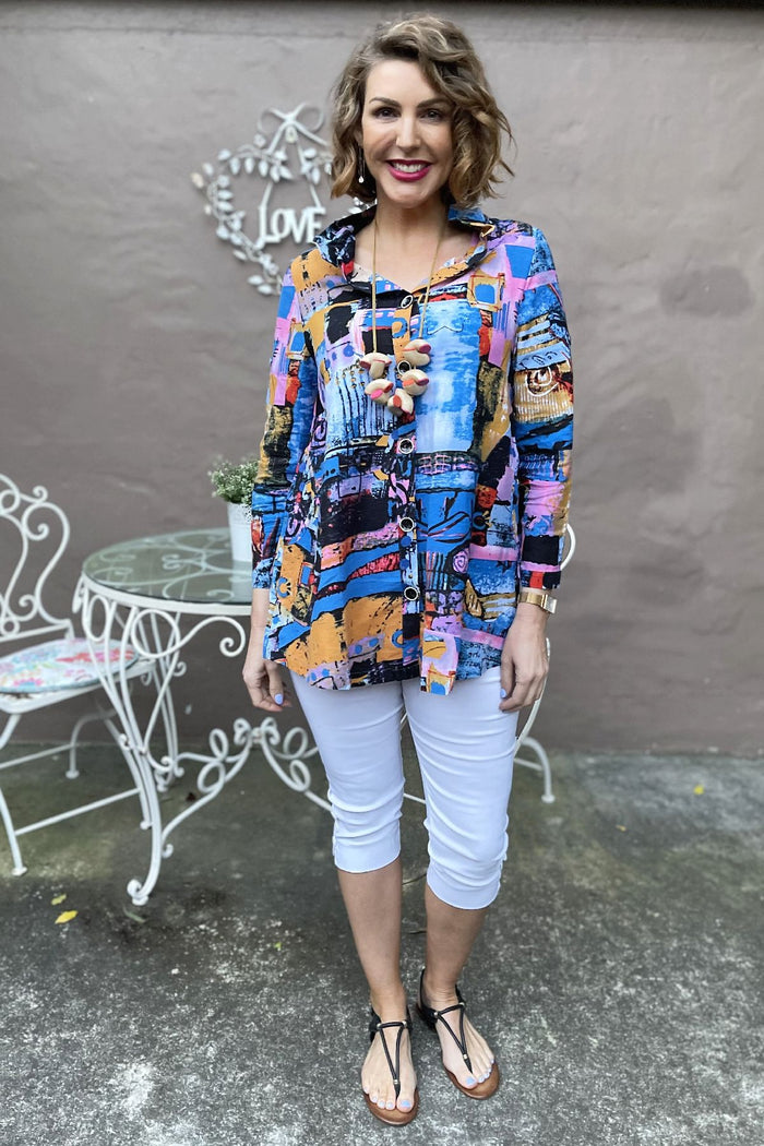 Blue train high collar tunic shirt by Ruby Rain, featuring a stylish high neckline and relaxed fit, displayed on a hanger.