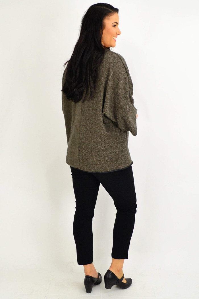 Taupe-brown Whispers tunic top with wide sleeves and front pockets, casual winter women's blouse displayed on a hanger.