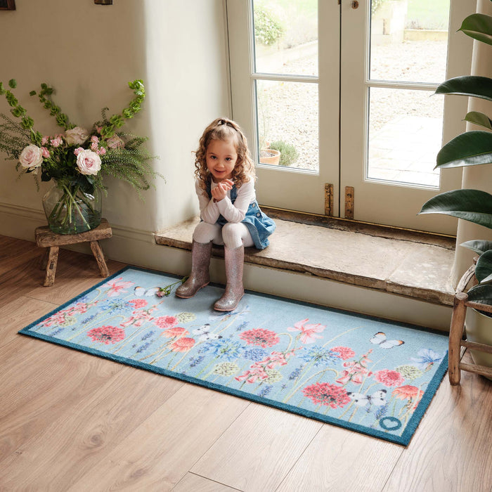 Butterfly Garden Blue Runner- 100% recycled cotton runner featuring a wildflower garden and butterflies.