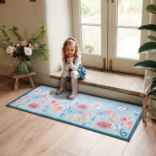 Butterfly Garden Blue Runner- 100% recycled cotton runner featuring a wildflower garden and butterflies.