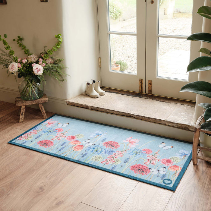 Butterfly Garden Blue Runner- 100% recycled cotton runner featuring a wildflower garden and butterflies.
