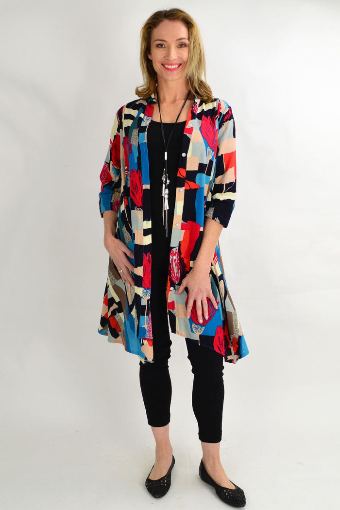 Hourglass cheery tulip stand collar long shirt tunic with a relaxed fit, featuring a vibrant floral pattern and button detail.