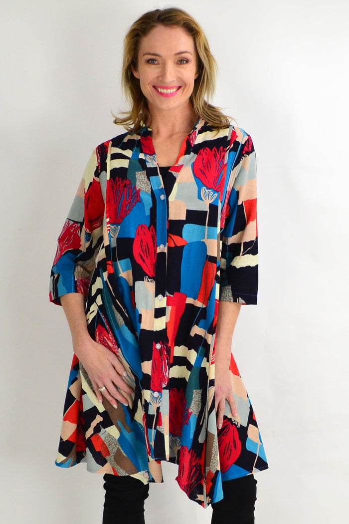 Colorful tulip-patterned long shirt by Hourglass featuring a stand collar and vibrant lines, perfect as a stylish tunic.
