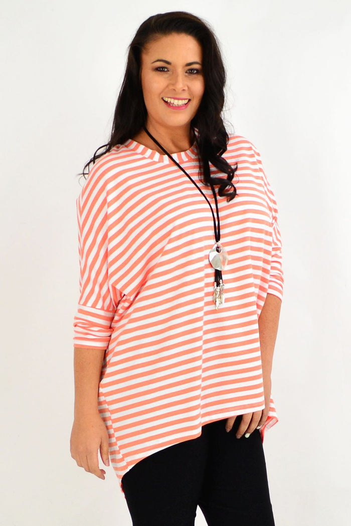 Pink and white striped Coral Swing Tunic Top by Cordelia St with long sleeves and relaxed fit, perfect for casual wear.