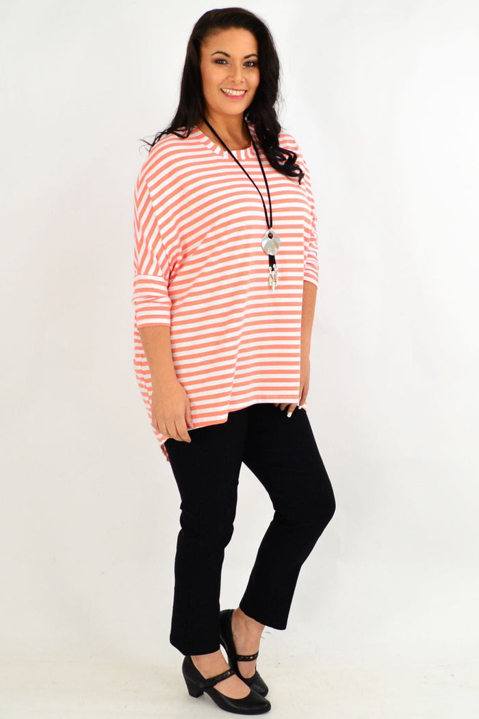 Pink and white striped Coral Swing Tunic Top by Cordelia St with long sleeves, casual and stylish for everyday wear.