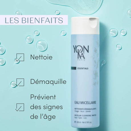 Bottle of Eau Micellaire Cleanser Makeup remover | Yon-Ka Paris on light blue background with water droplets, highlighting skincare benefits of cleansing, makeup removal, and age prevention.