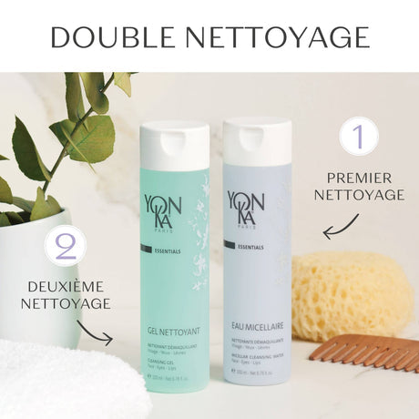 Two bottles of Eau Micellaire Cleanser Makeup remover | Yon-Ka Paris displayed with a natural sponge, wooden comb, and white towel in a skincare setting promoting a double cleansing routine.