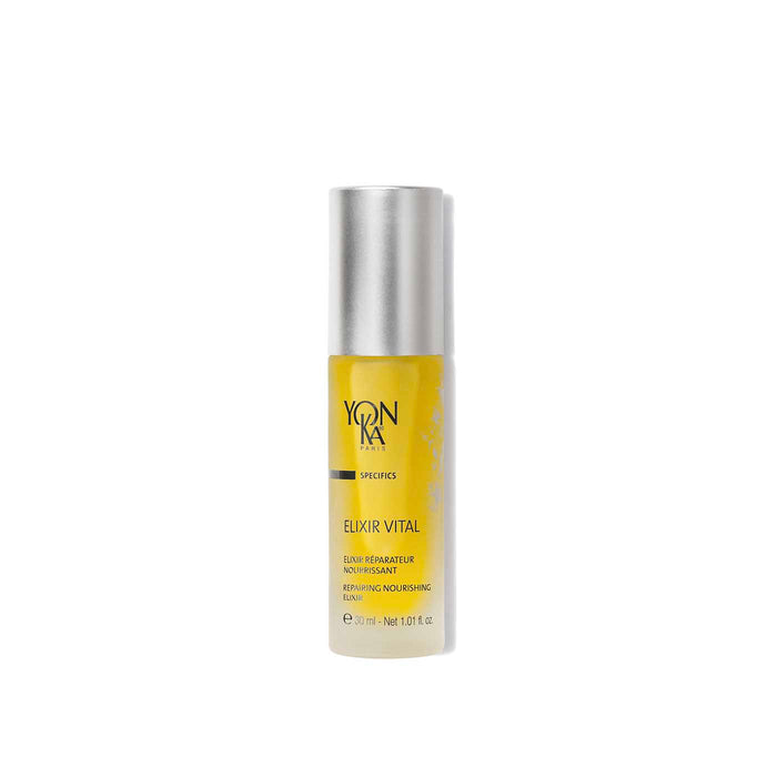 Elixir Vital Repairing Face Oil | Yon-Ka Paris in a sleek transparent bottle with a silver cap, showcasing golden nourishing facial oil for skincare and wellness.