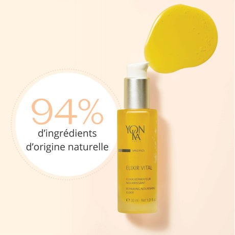 Close-up of a yellow bottle of Elixir Vital Repairing Face Oil | Yon-Ka Paris with a pump dispenser alongside a drop of golden face oil, highlighting 94% natural origin ingredients.