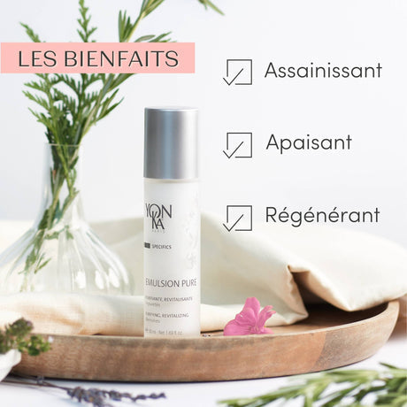 Emulsion Pure Purifying Tonic | Yon-Ka Paris bottle displayed on a wooden tray with fresh green herbs, highlighting its skincare benefits for purifying, soothing, and revitalizing skin.