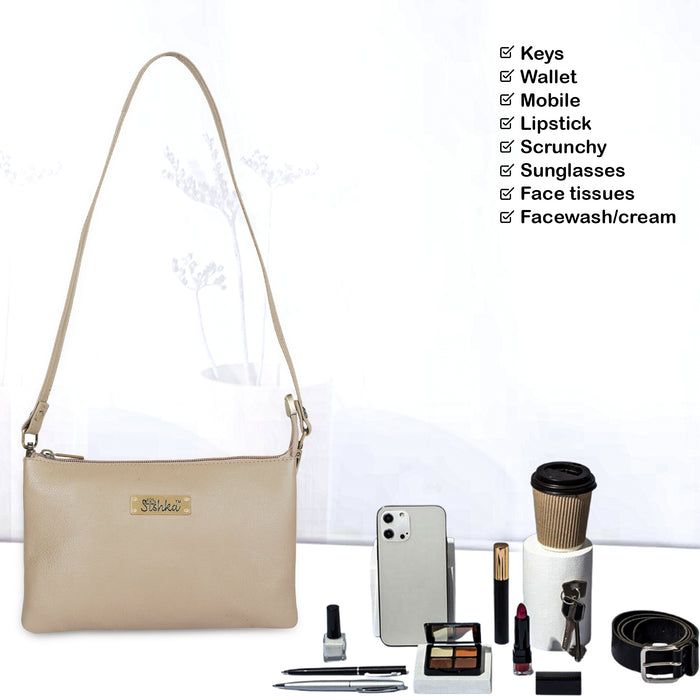 Women's taupe leather crossbody sling bag for work, travel, and daily use-feature image