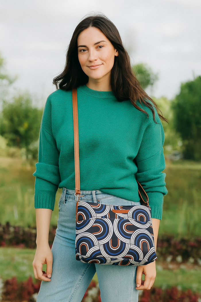 Abstract printed canvas shoulder‑sling bag with soft relaxed silhouette for office and daily use-model image