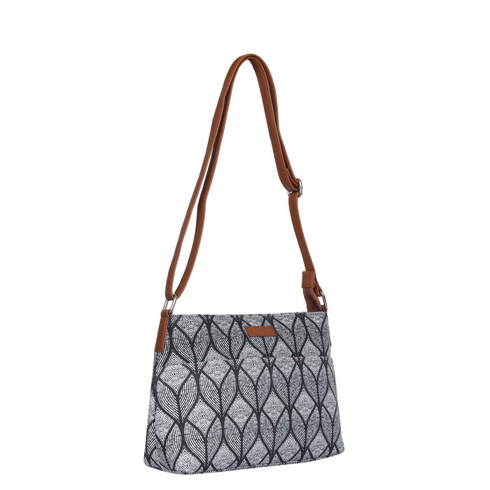 Monochrome printed canvas shoulder‑sling bag with soft relaxed silhouette for daily and travel use-half side view