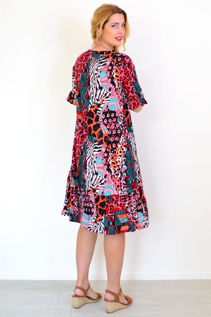 Jessica sleeved tunic dress by One Summer, featuring a relaxed fit and stylish design, displayed on a model against a neutral background.