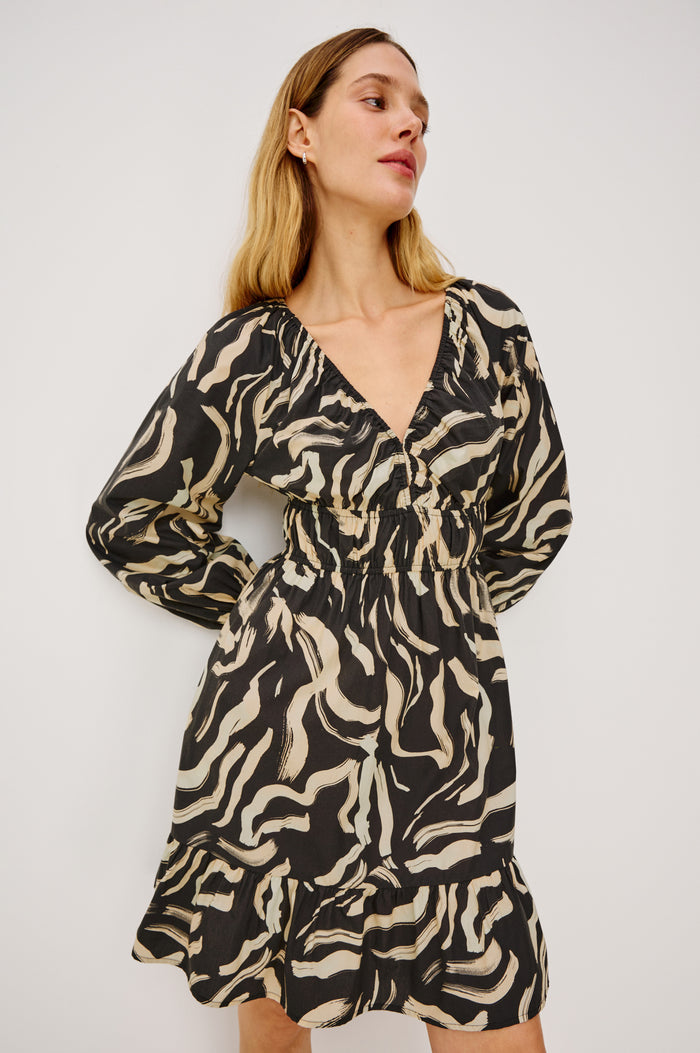 Krina Mini Dress in Cotton Poplin With Deep V-Neckline, Center Front Ties, Long Billowing Sleeves, and Tiered Hem in Caicos Colorway - Upper Body Front View Featured on Model