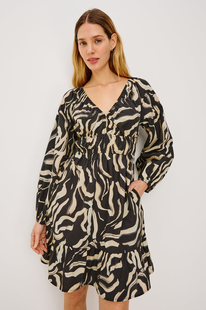 Krina Mini Dress in Cotton Poplin With Deep V-Neckline, Center Front Ties, Long Billowing Sleeves, and Tiered Hem in Caicos Colorway - Upper Body Front View Featured on Model
