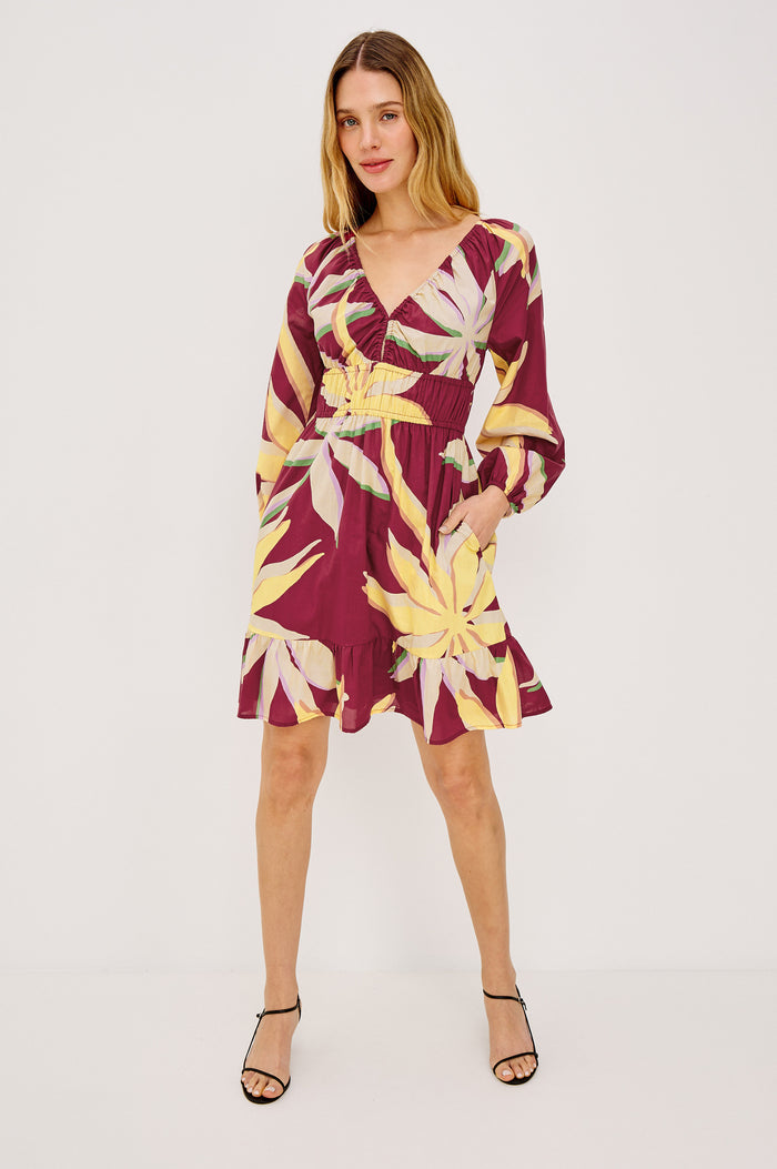 Krina Mini Dress in Cotton Poplin With Deep V-Neckline, Center Front Ties, Long Billowing Sleeves, and Tiered Hem in Red Palma Colorway - Upper Body Front View Featured on Model