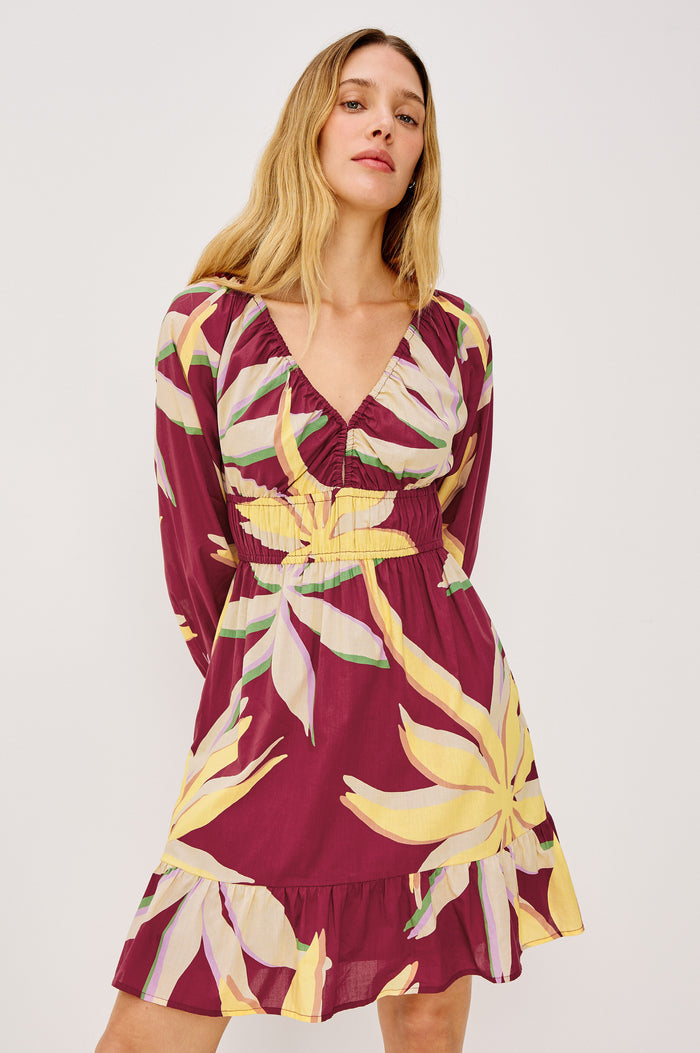 Krina Mini Dress in Cotton Poplin With Deep V-Neckline, Center Front Ties, Long Billowing Sleeves, and Tiered Hem in Red Palma Colorway - Upper Body Front View Featured on Model
