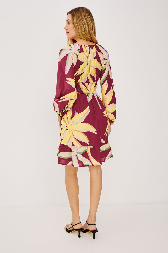 Krina Mini Dress in Cotton Poplin With Deep V-Neckline, Center Front Ties, Long Billowing Sleeves, and Tiered Hem in Red Palma Colorway - Full Body Back View Featured on Model