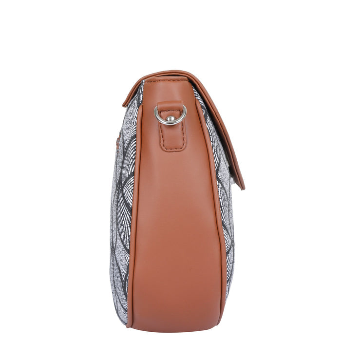 Monochrome printed canvas shoulder‑sling bag with tall soft silhouette for daily and travel use-side view