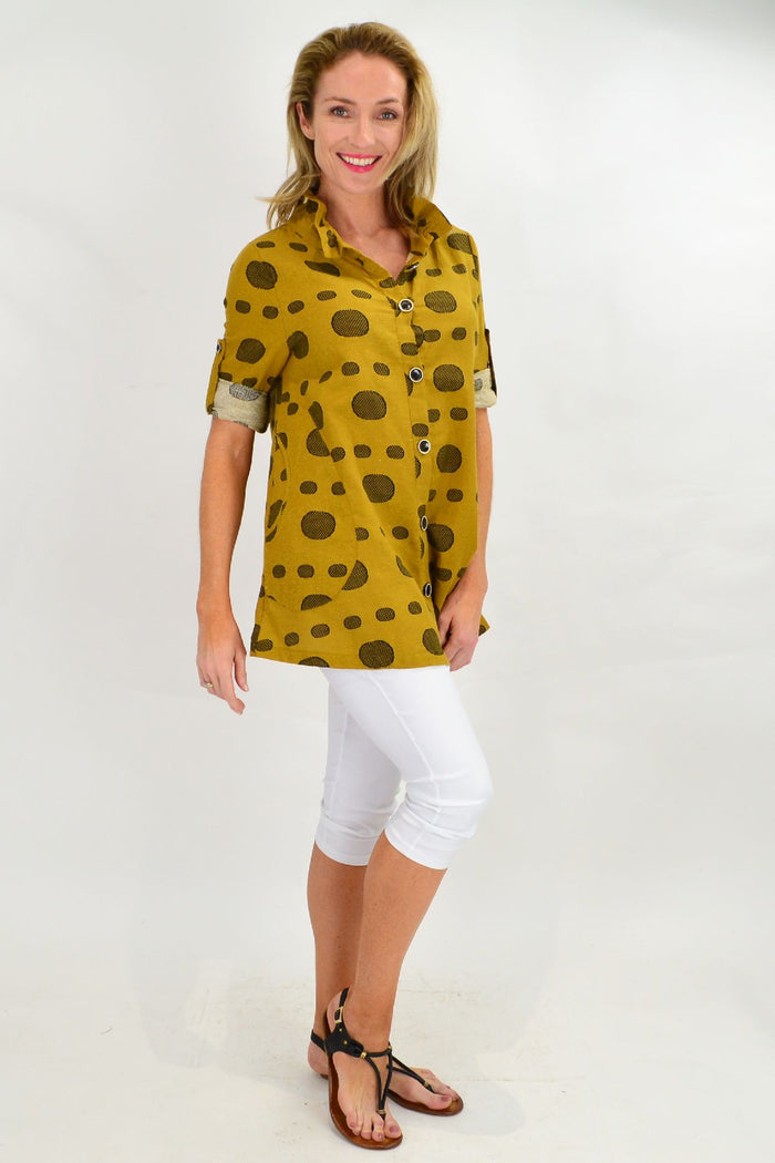 Mustard spot high collar tunic shirt by Ruby Rain, shown with long sleeves and a button front in a close-up image.