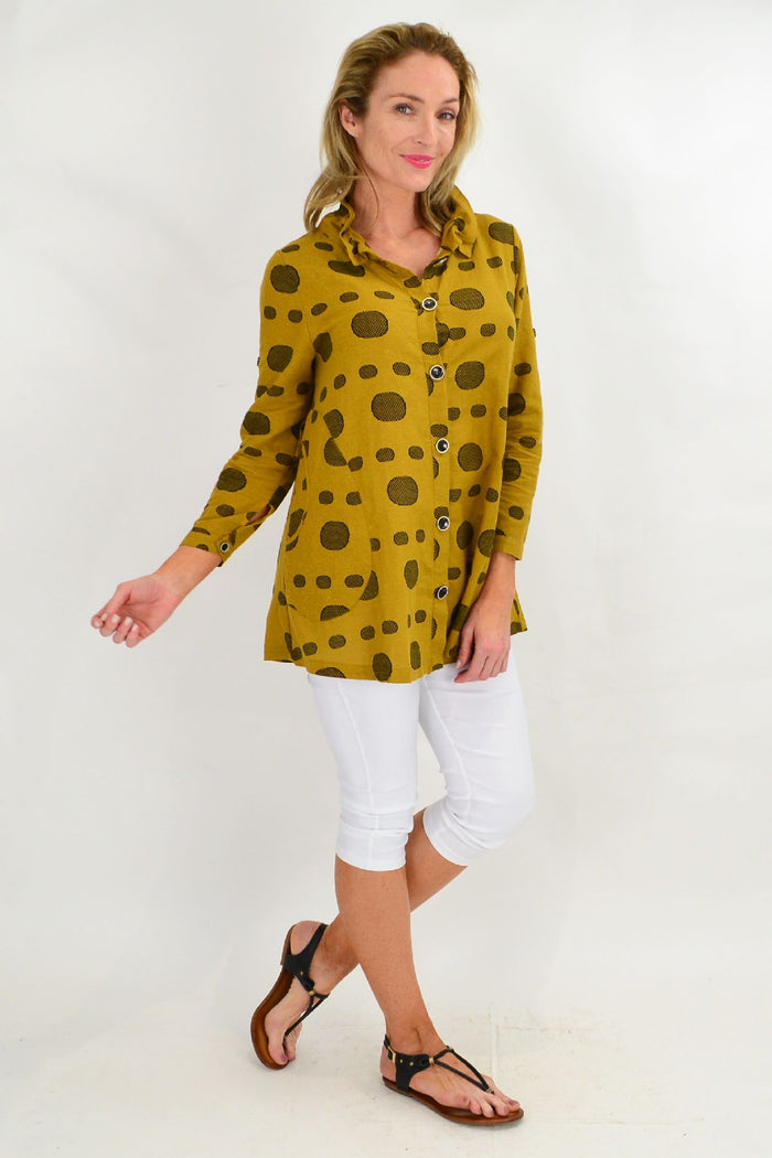 Mustard spot high collar tunic shirt by Ruby Rain, featuring a stylish high neckline and vibrant print, shown on a model.