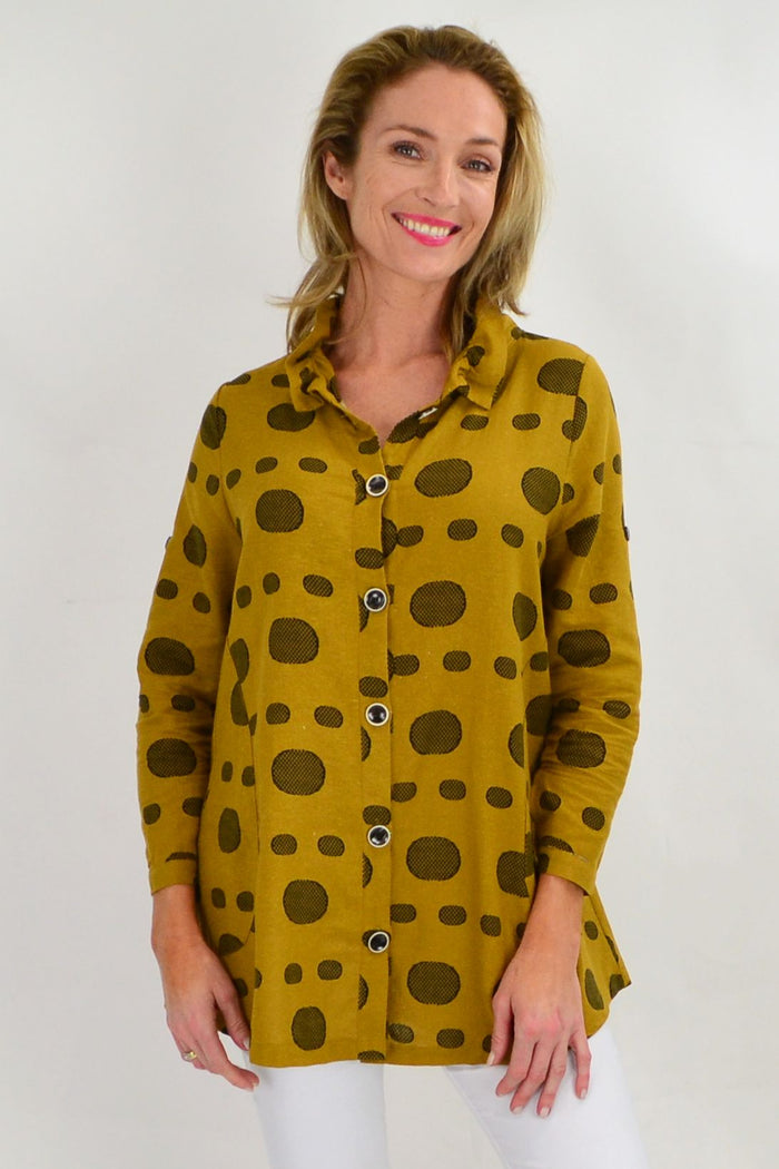 Mustard Spot High Collar Tunic Shirt by Ruby Rain, featuring a high collar and vibrant spotted pattern, shown on a hanger.
