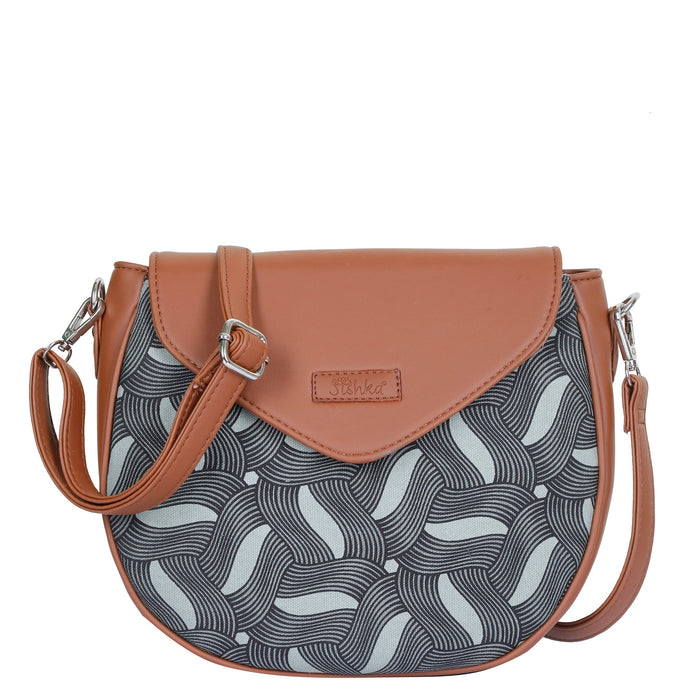 Olive green printed canvas shoulder‑sling bag with tall soft silhouette for travel and everyday use