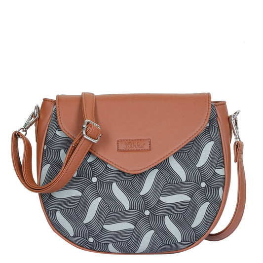 Olive green printed canvas shoulder‑sling bag with tall soft silhouette for travel and everyday use