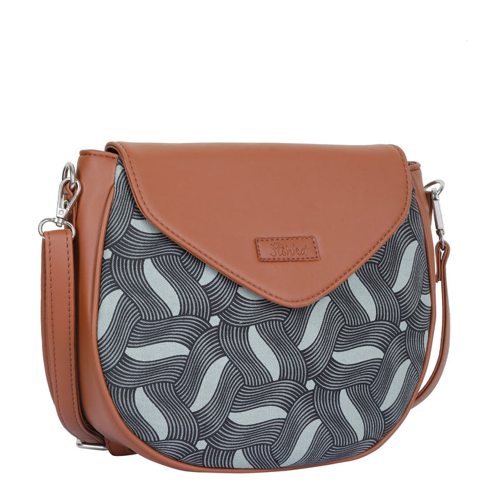 Olive green printed canvas shoulder‑sling bag with tall soft silhouette for travel and everyday use-half side view