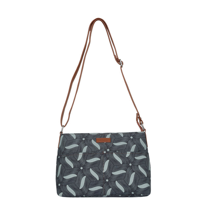 Olive green printed canvas shoulder‑sling bag with soft relaxed silhouette for travel and everyday use