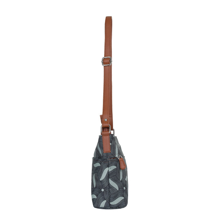 Olive green printed canvas shoulder‑sling bag with soft relaxed silhouette for travel and everyday use-side view