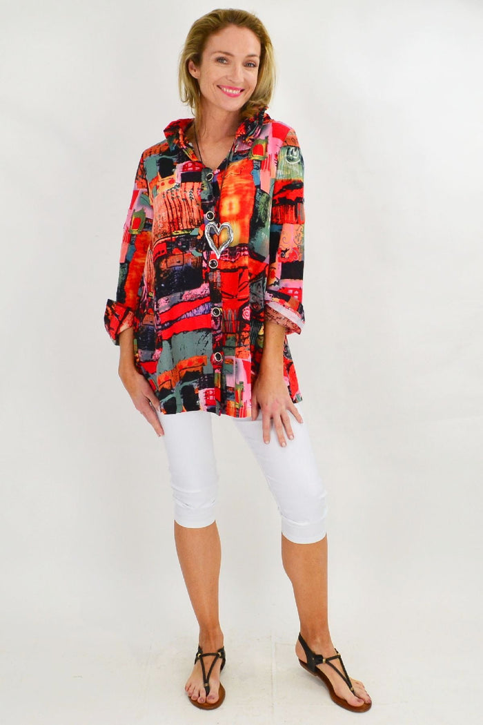 Colorful orange train high collar tunic shirt by Ruby Rain, featuring a vibrant design and comfortable fit.