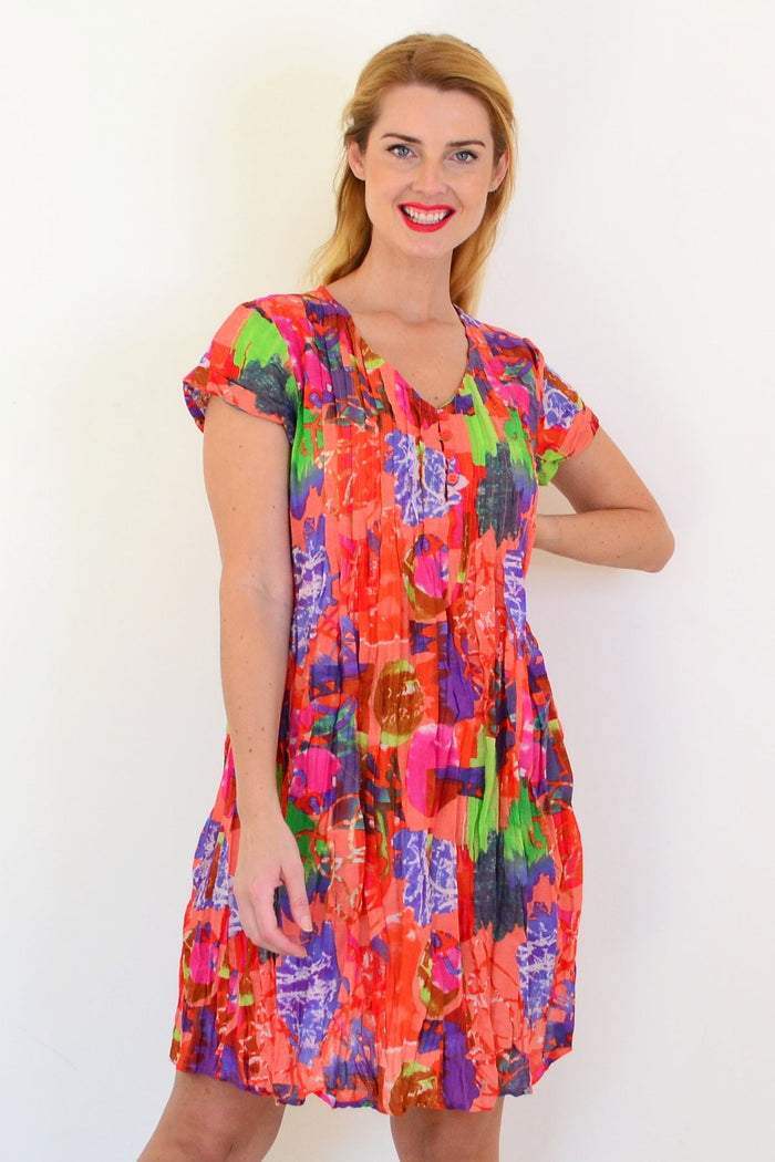 Orange tropical Nicola tunic from One Summer featuring cap sleeves and a relaxed, flowy design perfect for warm weather.