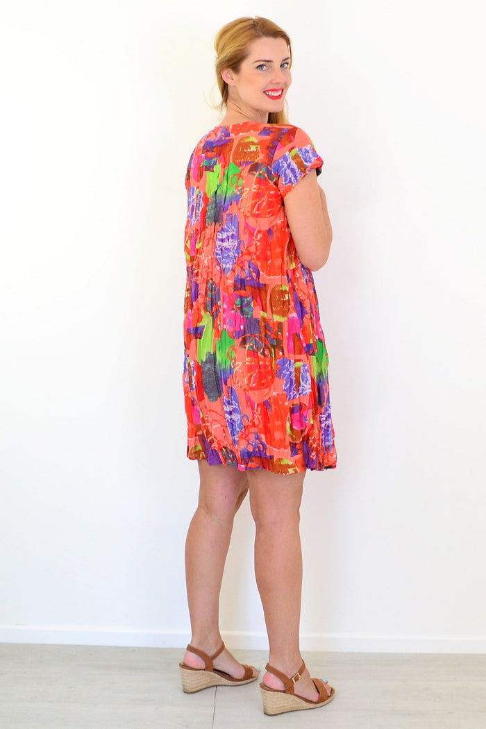 Orange tropical Nicola tunic dress with cap sleeves by One Summer, featuring a breezy, colorful design perfect for summer wear.