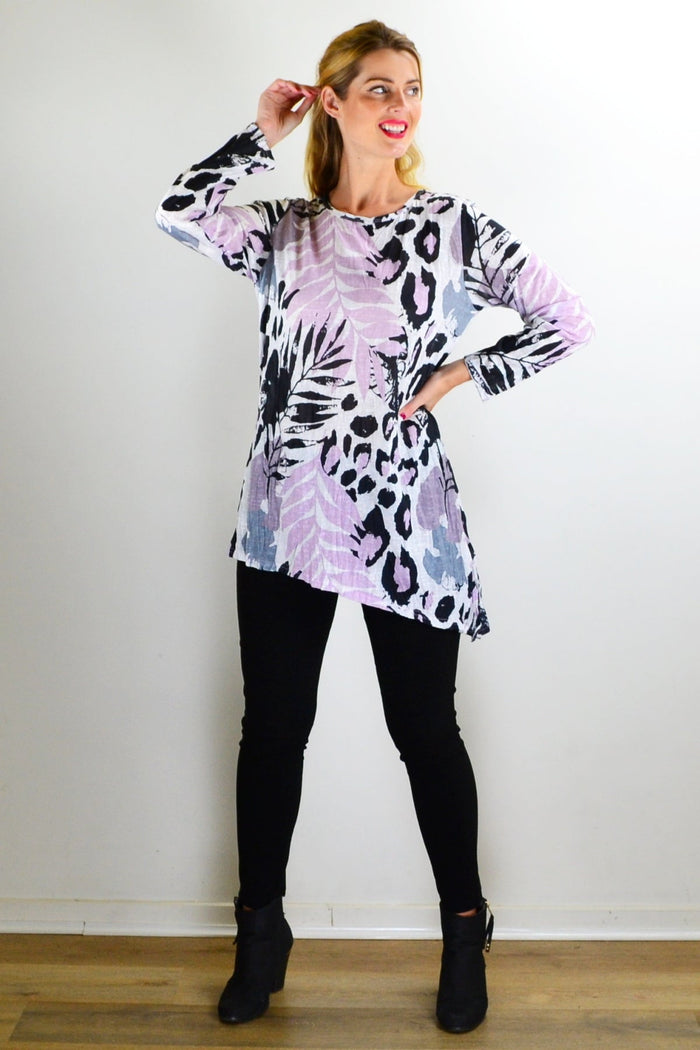 Pink jungle print crinkle tunic top from Cafe Latte, featuring a relaxed fit and vibrant floral pattern.