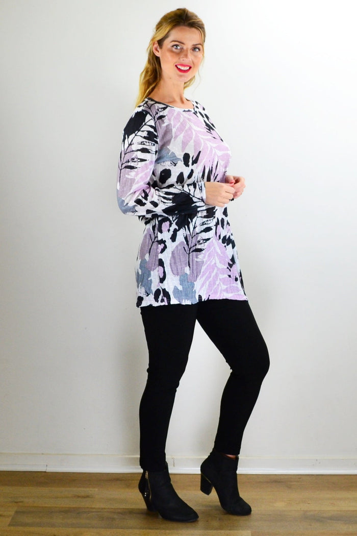 Pink jungle print crinkle tunic top by Cafe Latte, showing a flowy, lightweight fabric with vibrant tropical jungle design.