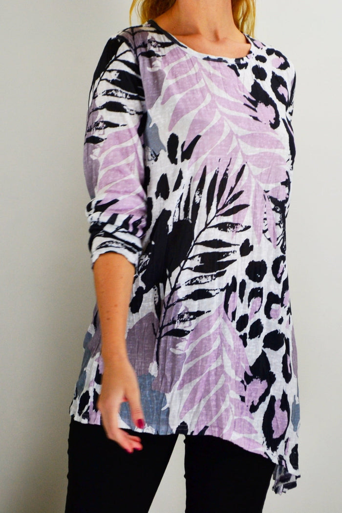 Pink jungle print crinkle tunic top by Cafe Latte, featuring a relaxed fit and vibrant tropical-inspired design.